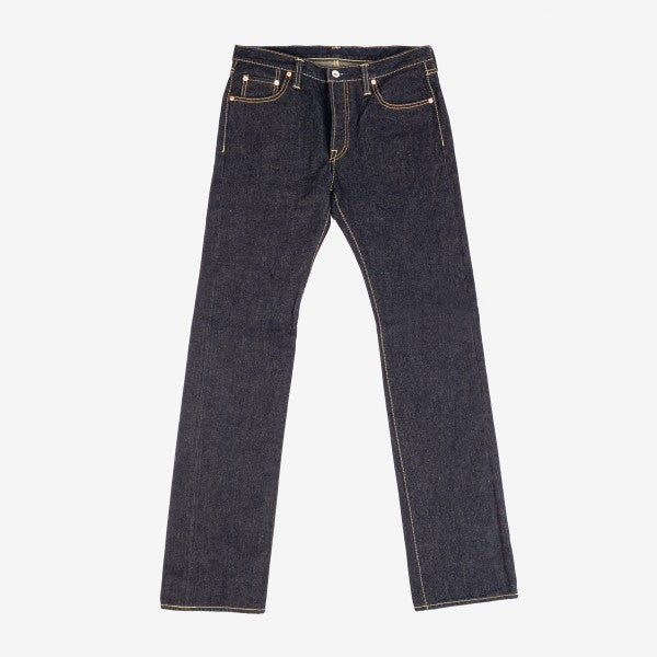 Dark blue selvedge denim jeans with classic five-pocket design on white background