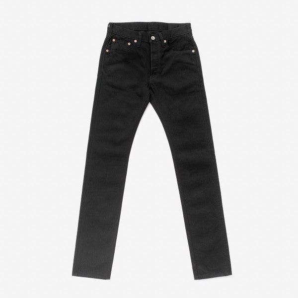 black slim fit jeans with five pockets laid flat on white background