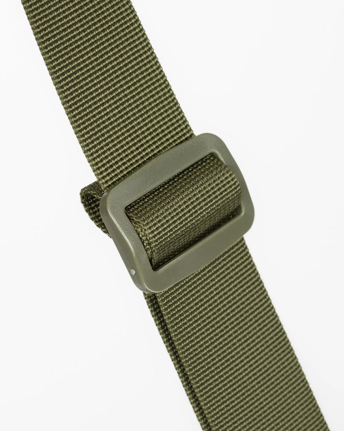 Close-up of an olive green webbed strap with a matching olive green plastic buckle, shown against a plain light gray background.