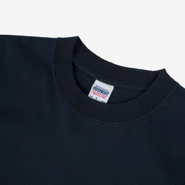 Close-up of black Iron Heart heavy cotton crewneck sweatshirt neckline and label