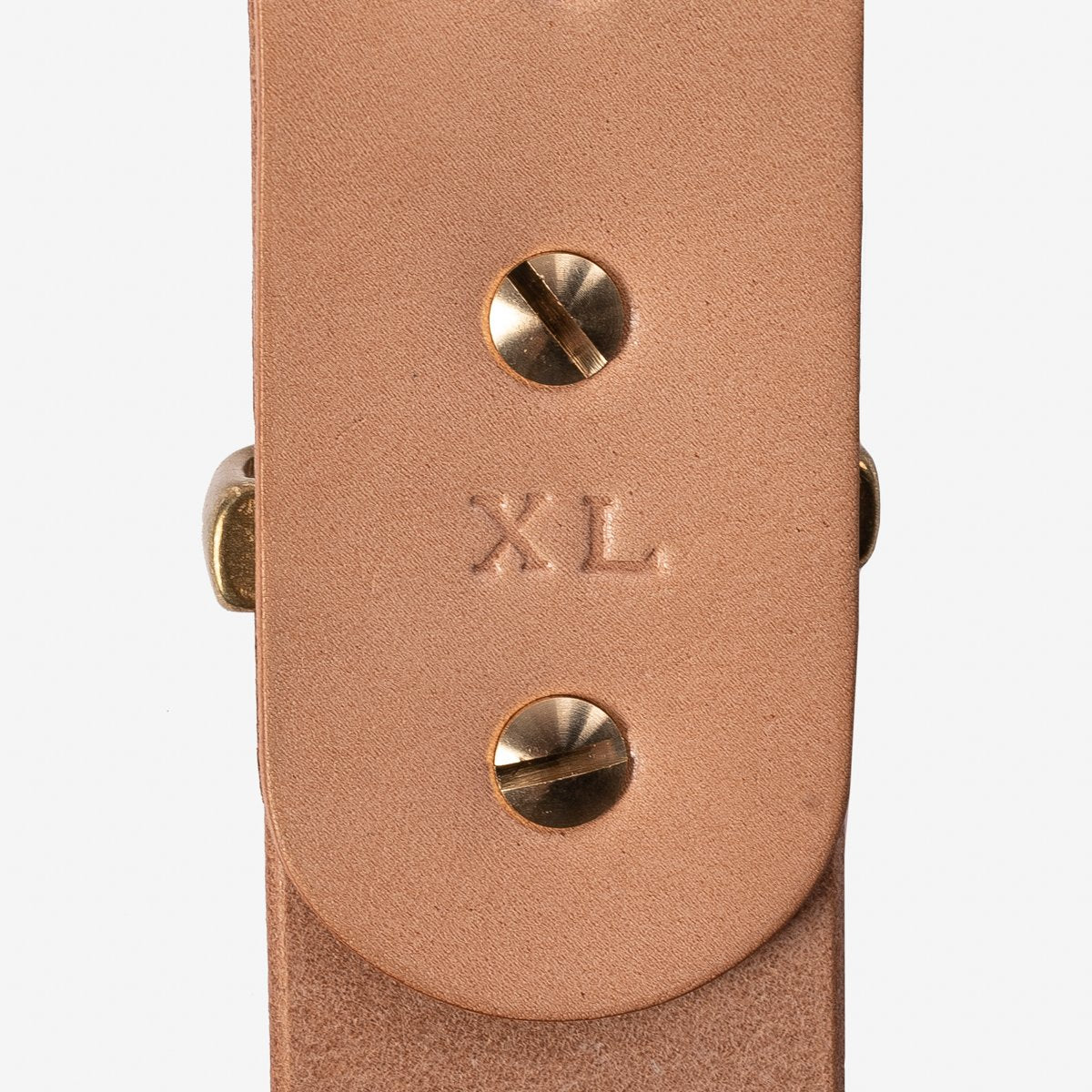 Natural leather belt end with XL size embossed and brass screws detail from Iron Shop Provisions