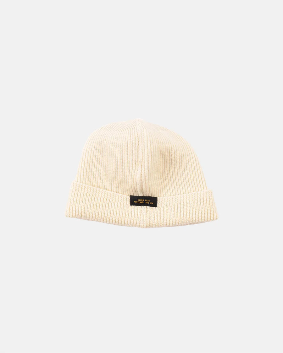 Natural color ribbed wool knit watch cap with folded brim and Dehen 1920 label