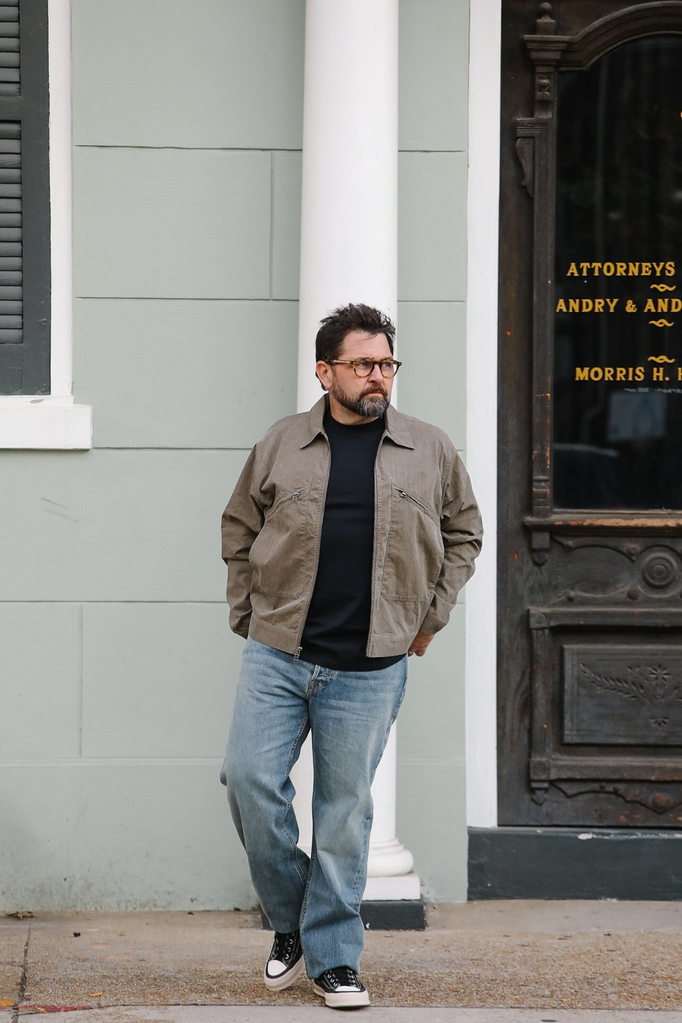 Man standing in front of a building with classical architecture