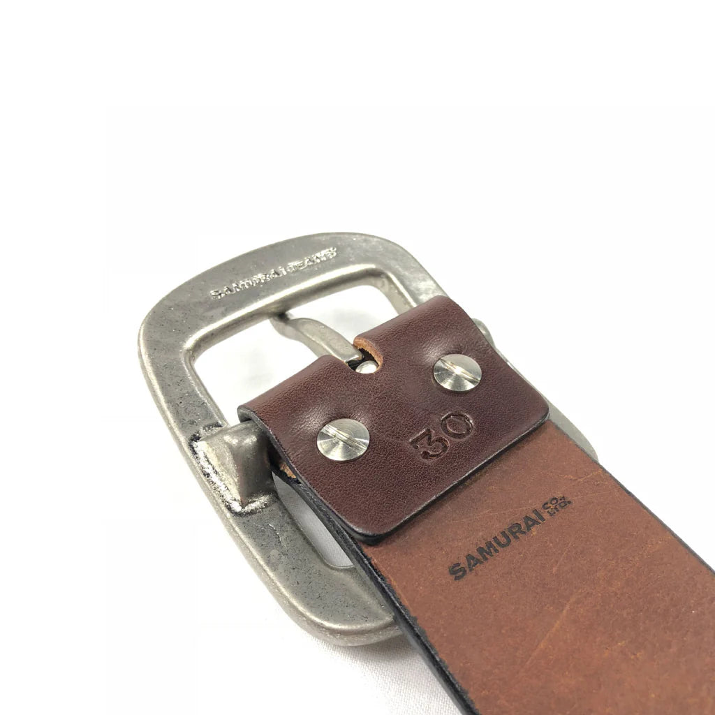 Close-up of brown leather belt with silver metal buckle and 'SAMURAI' embossed logo, size 30