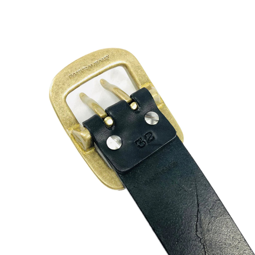 Black leather belt with dual brass prong buckle embossed with Samurai Jeans logo and size 32