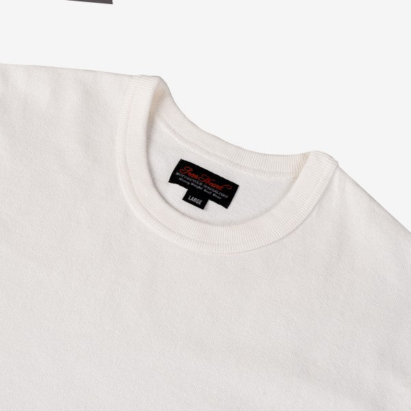 Close-up of white crewneck sweatshirt with Iron Shop Provisions tag, size large, on neutral background