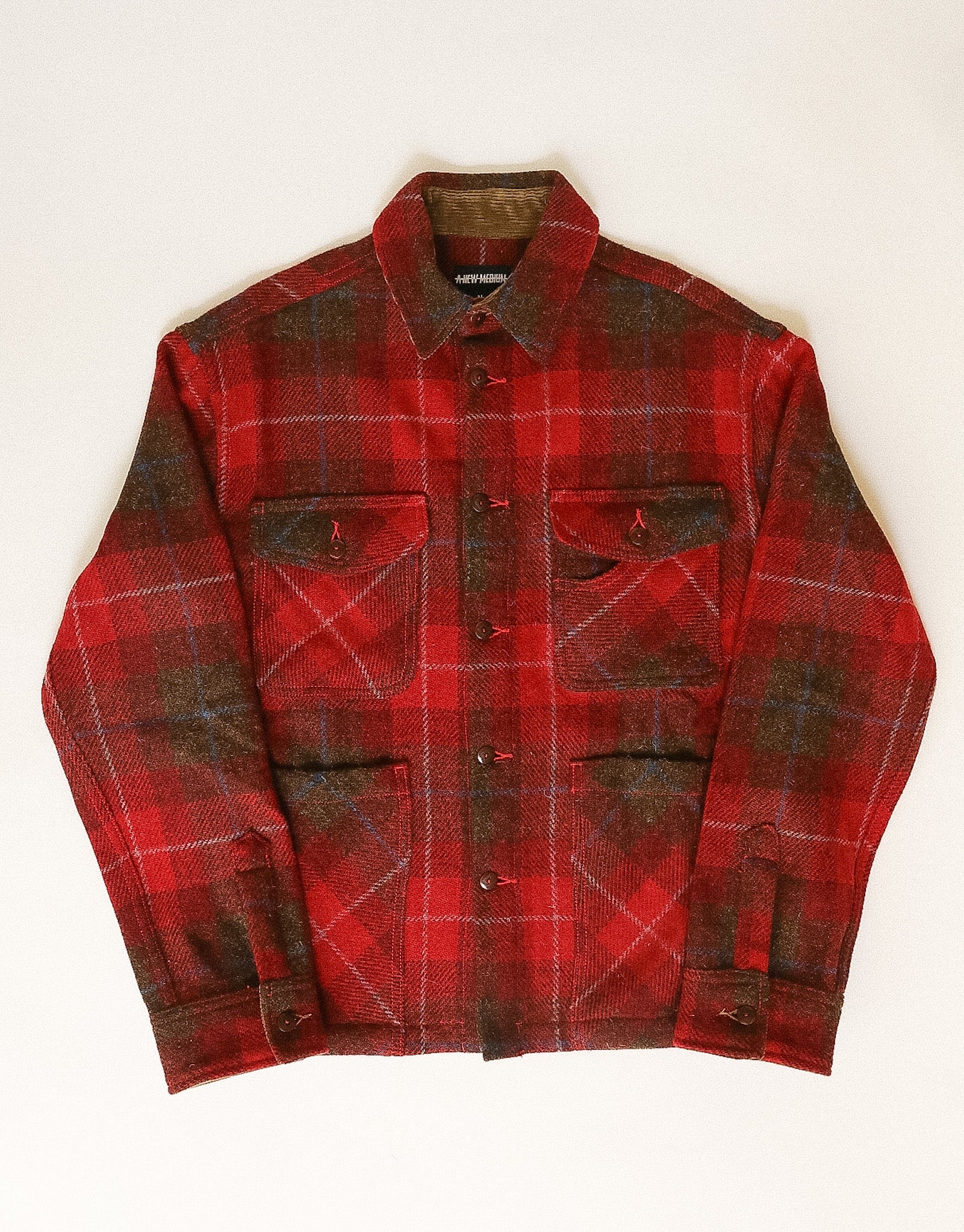 Red and black plaid jacket on a white background