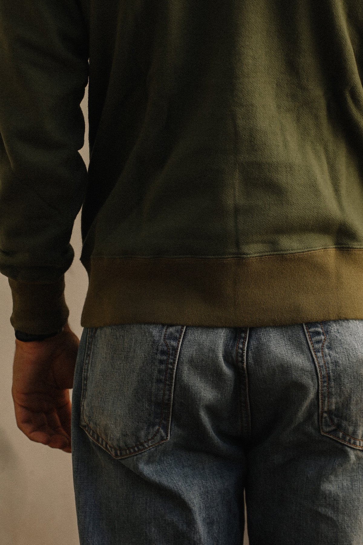 Close up detail of a dark green sweater 