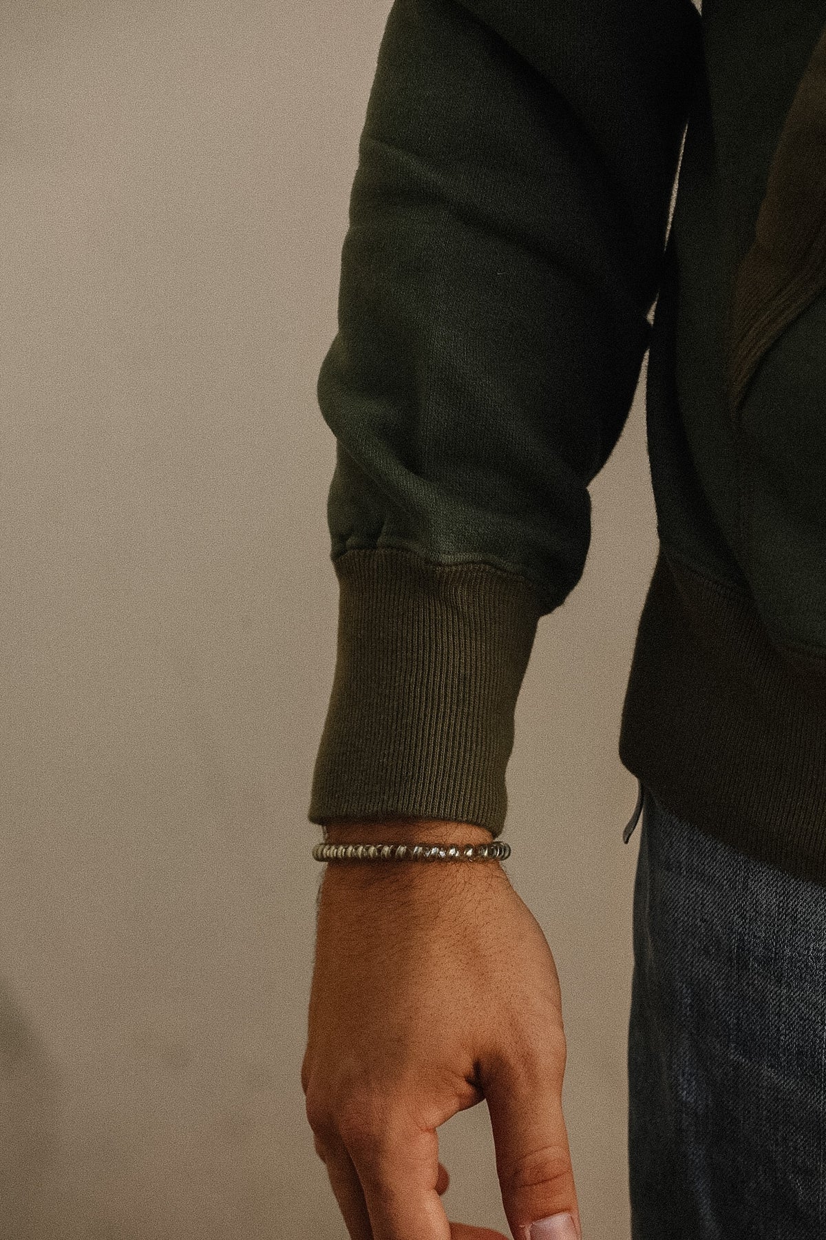 Close up detail of a dark green sweater 