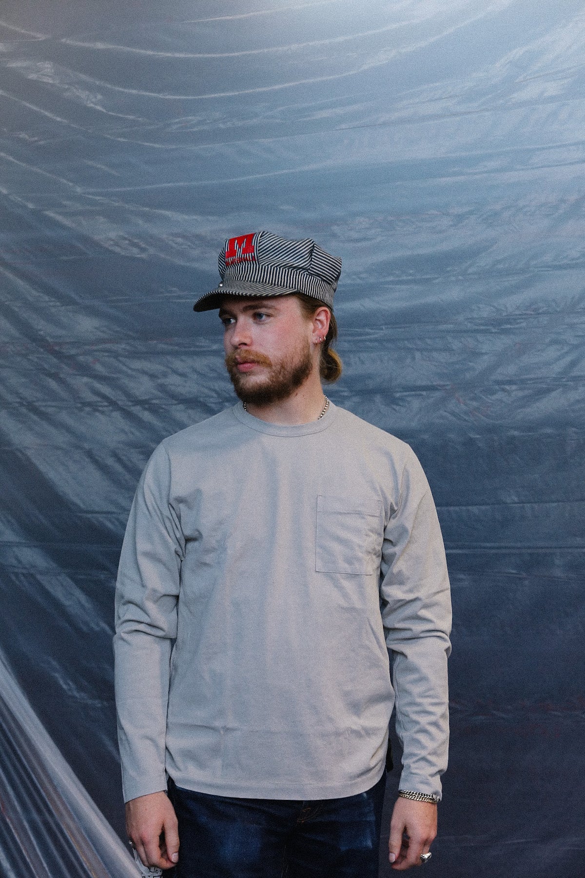 man wearing a long sleeve grey t-shirt