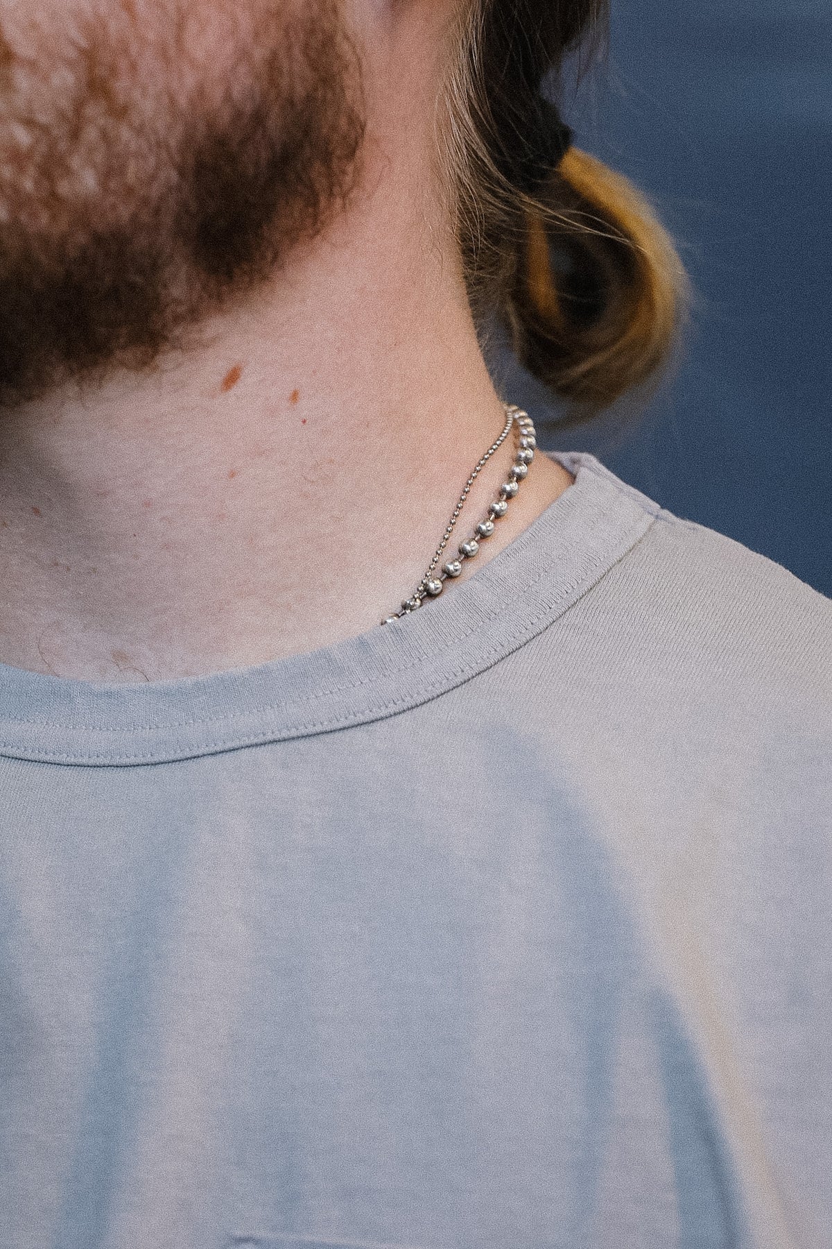 close up detail of a long sleeve grey t-shirt