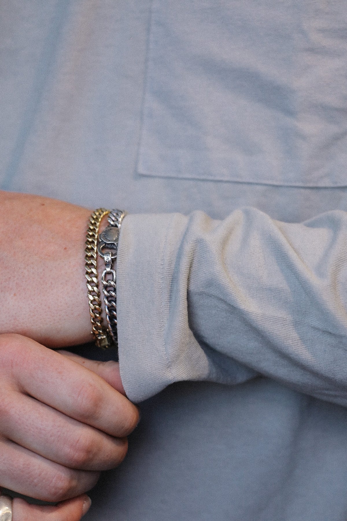 close up detail of a long sleeve grey t-shirt