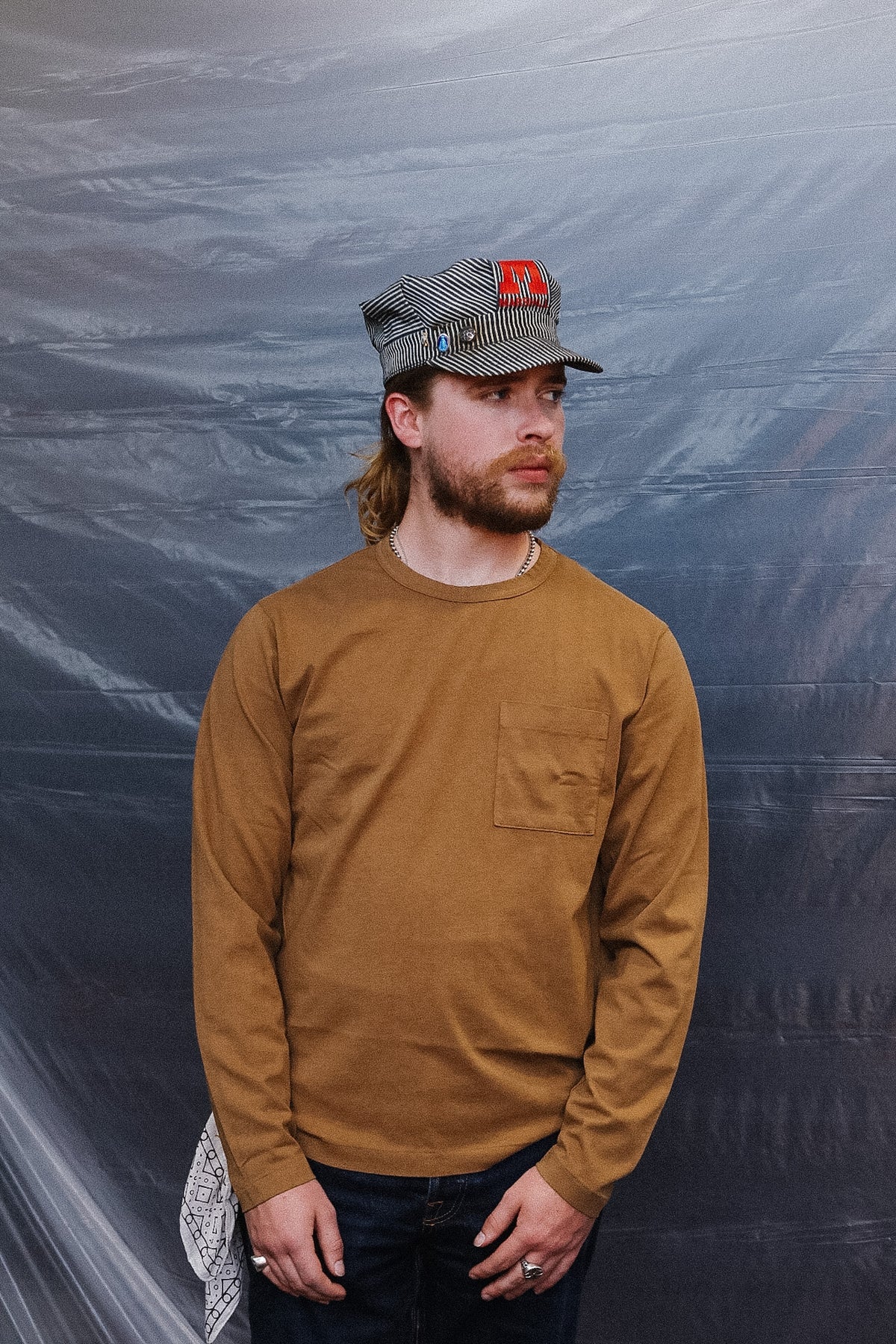 man wearing  brown long sleeve t-shirt