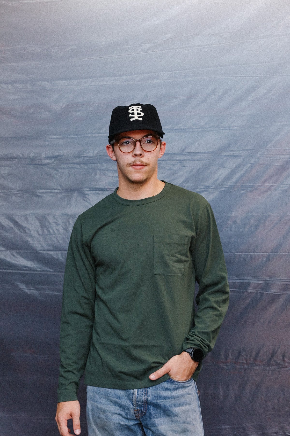 man wearing green long sleeve t-shirt