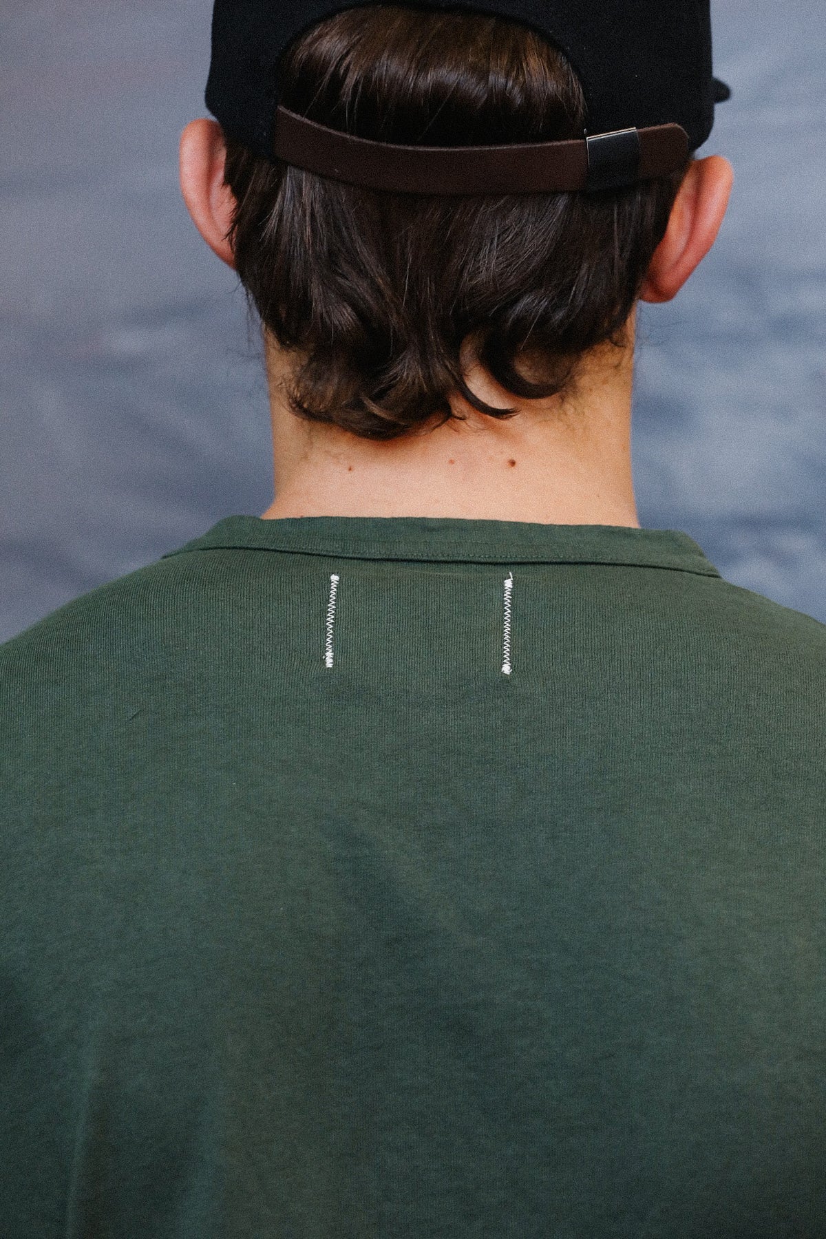 Up close detail of green long sleeve t-shirt