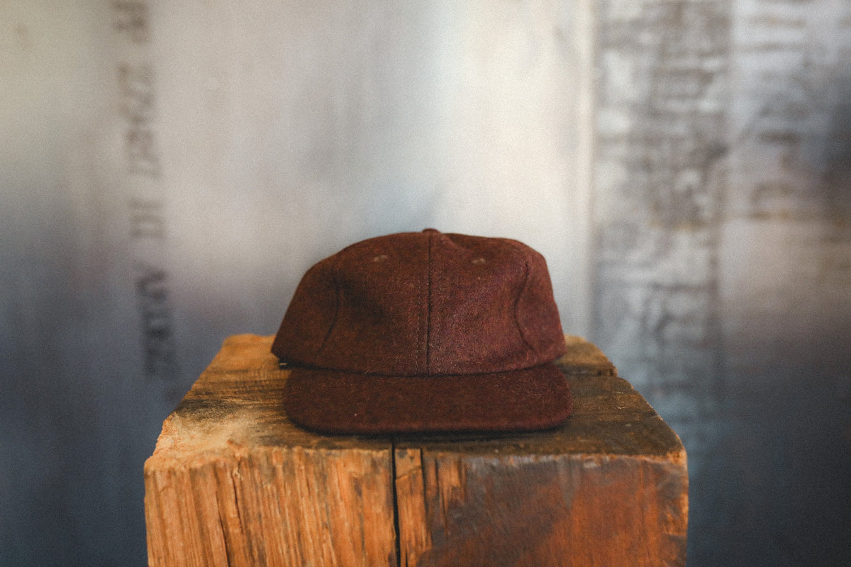 red cap on a wood block 