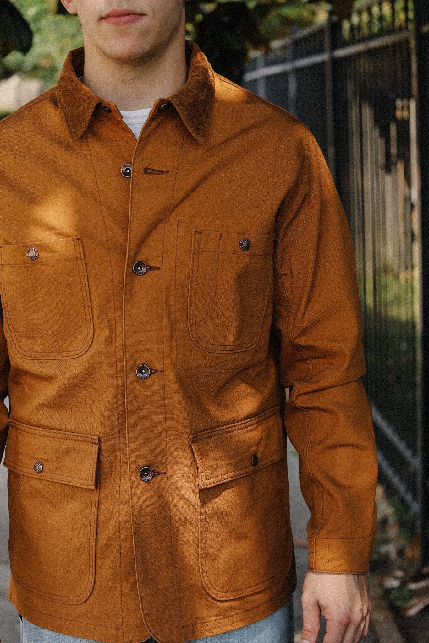 Men's workwear jacket in brown canvas with corduroy collar and multiple snap pockets