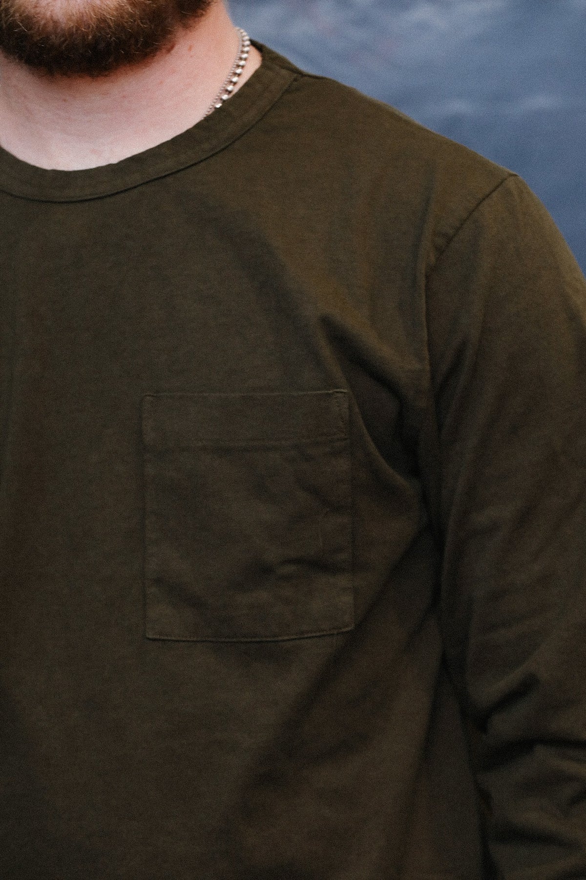 Green long sleeve t-shirt close up detail