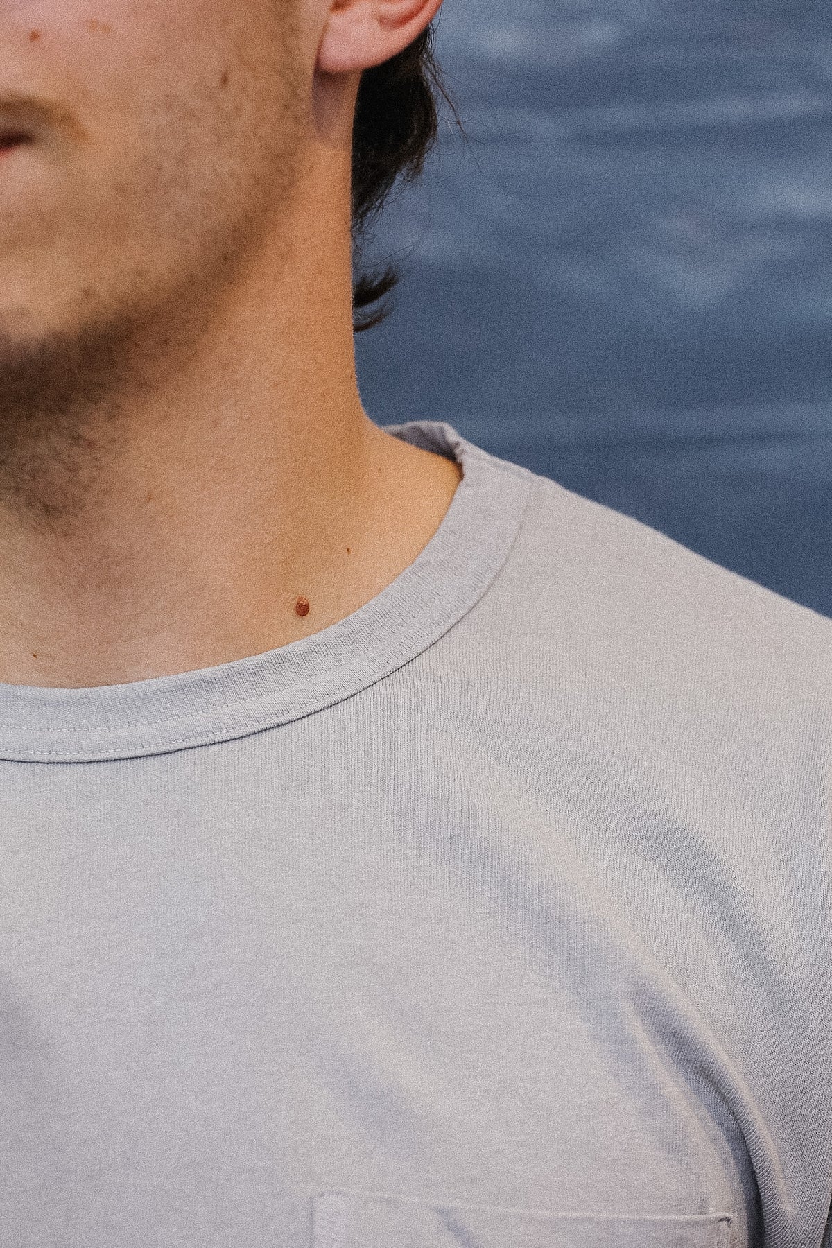 man wearing a grey t-shirt