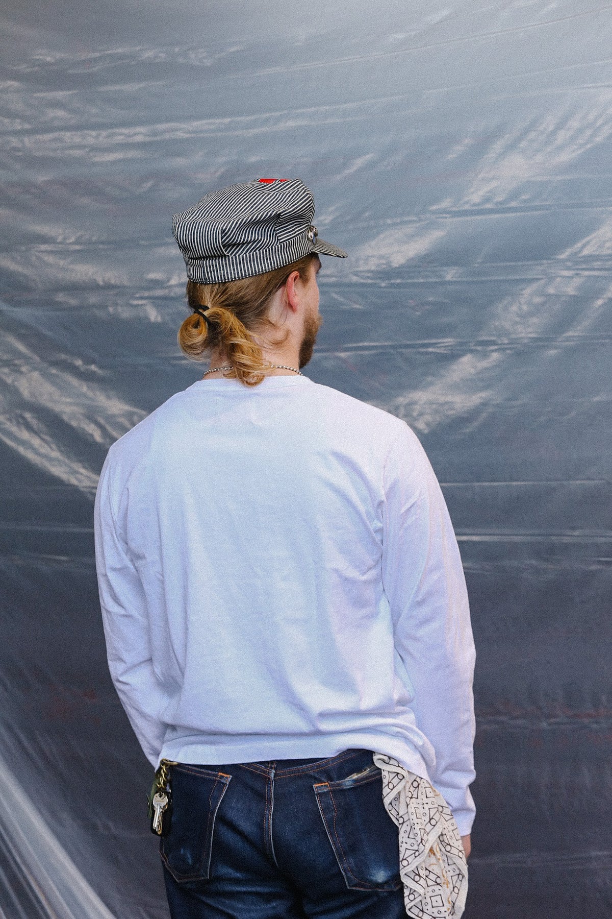 Man wearing long sleeve white t shirt