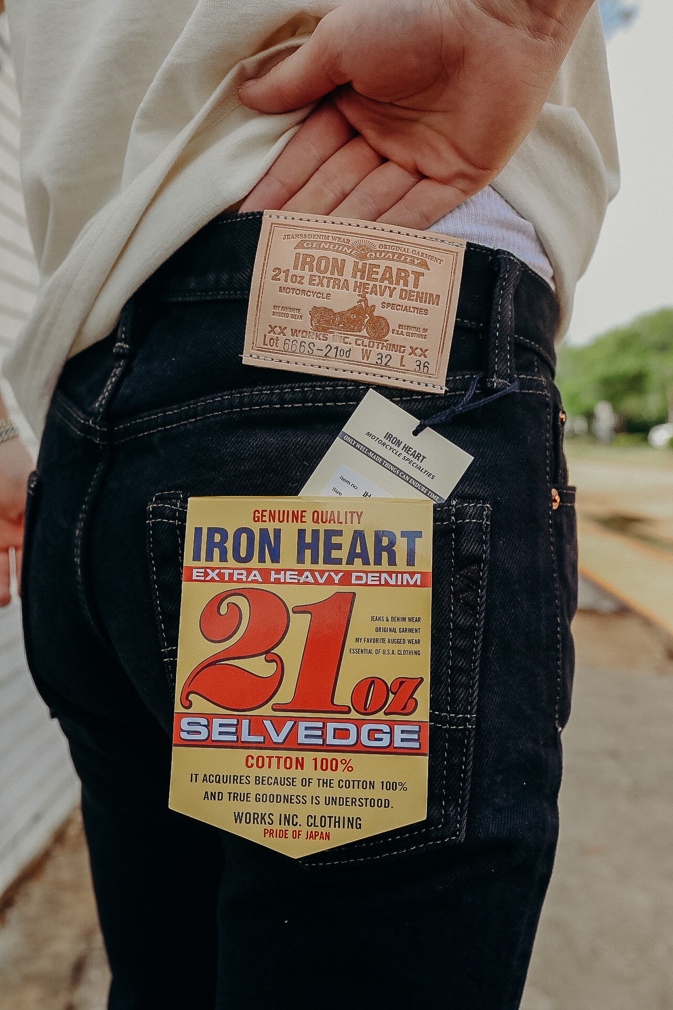 Close-up of iron heart 21 oz extra heavy denim jeans with labels on back pocket and waistband