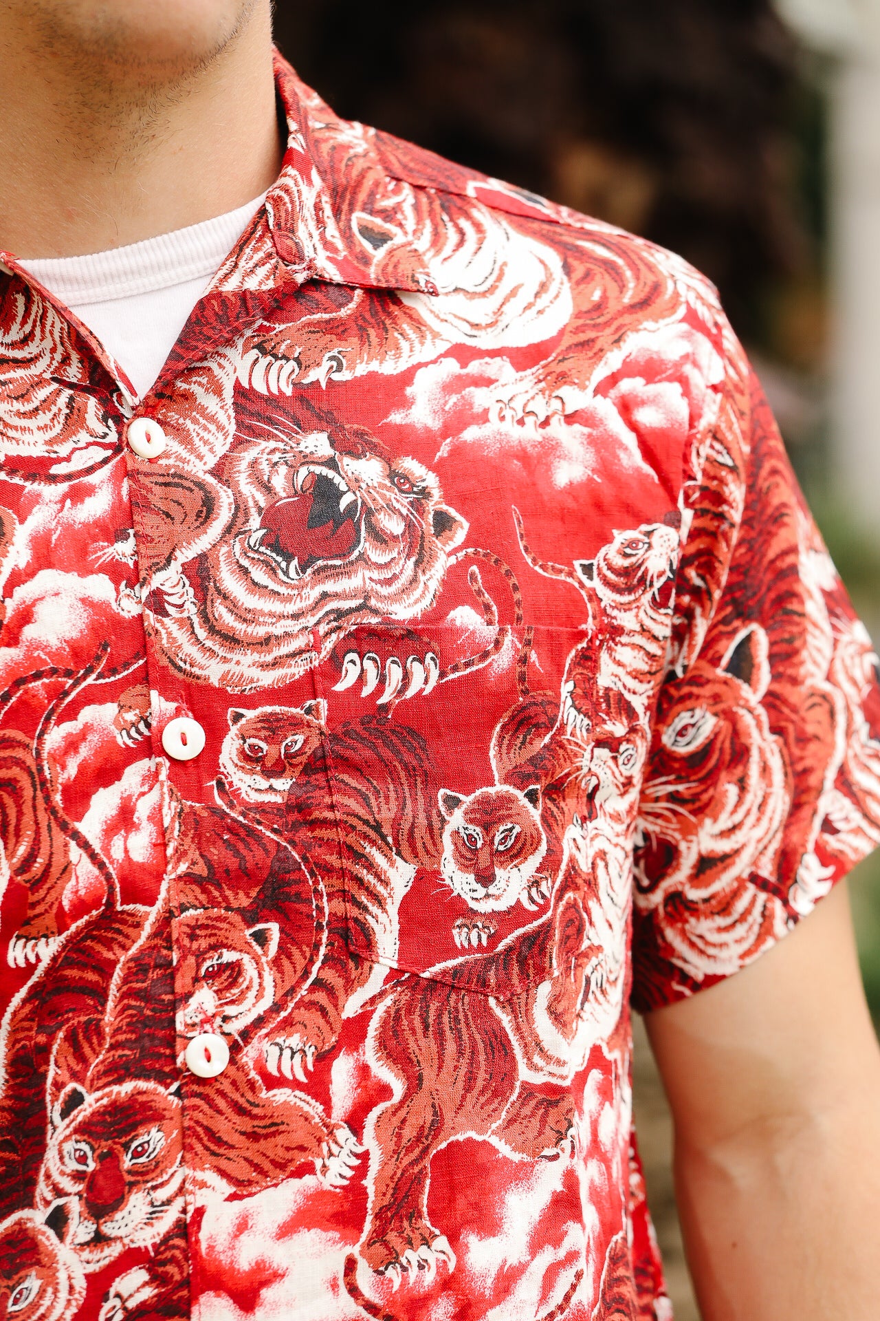 Red and white tiger patterned shirt worn by a person