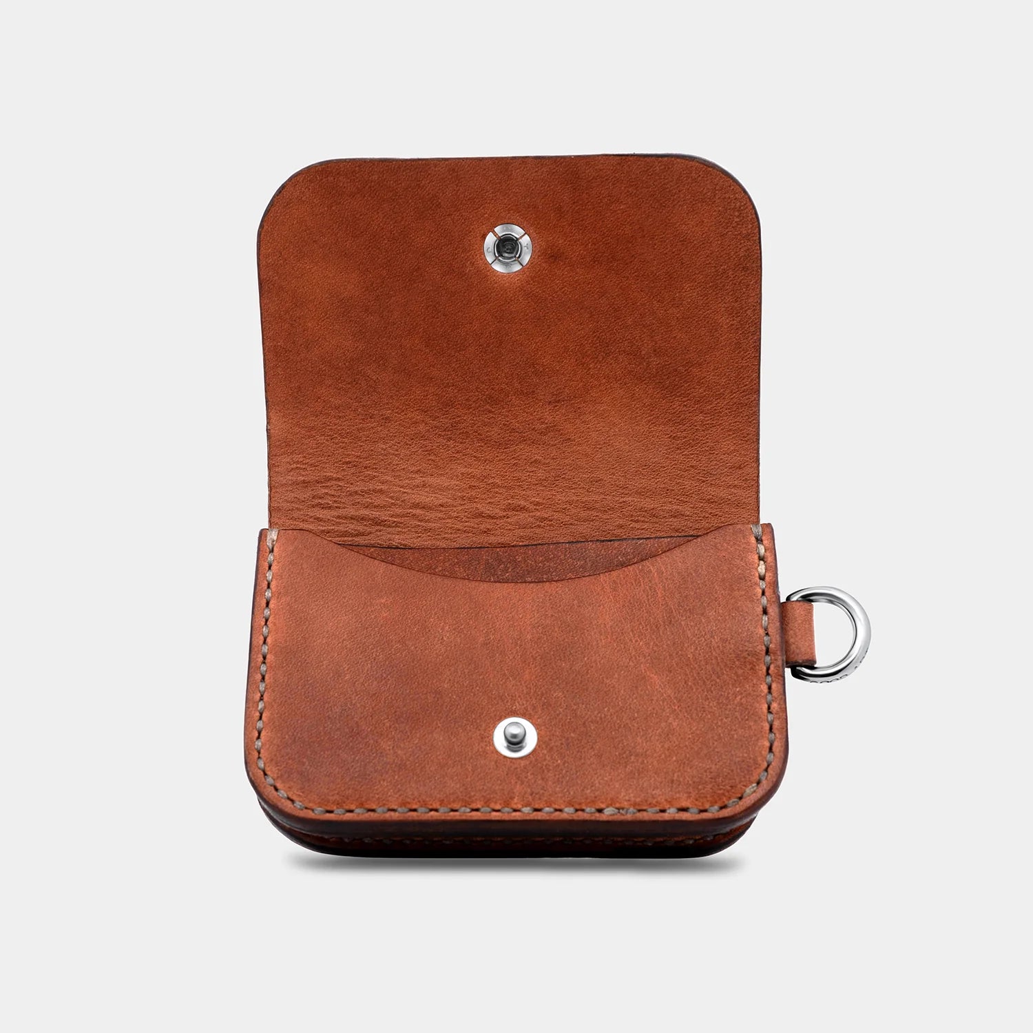 Natural brown cow leather card satchel with snap closure and metal ring, fully open view