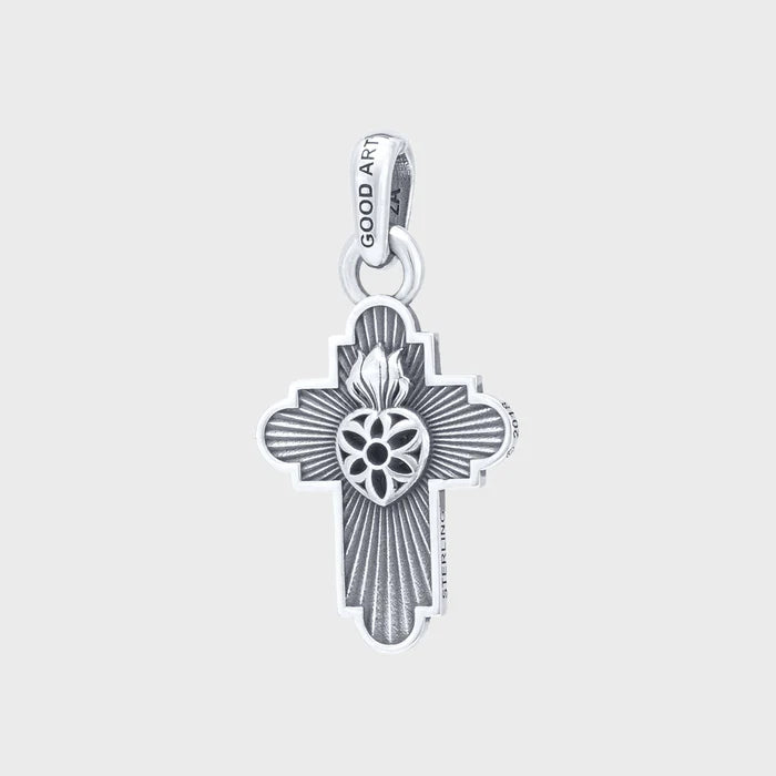 Sterling silver Good Art cross pendant with flaming sacred heart design on white background