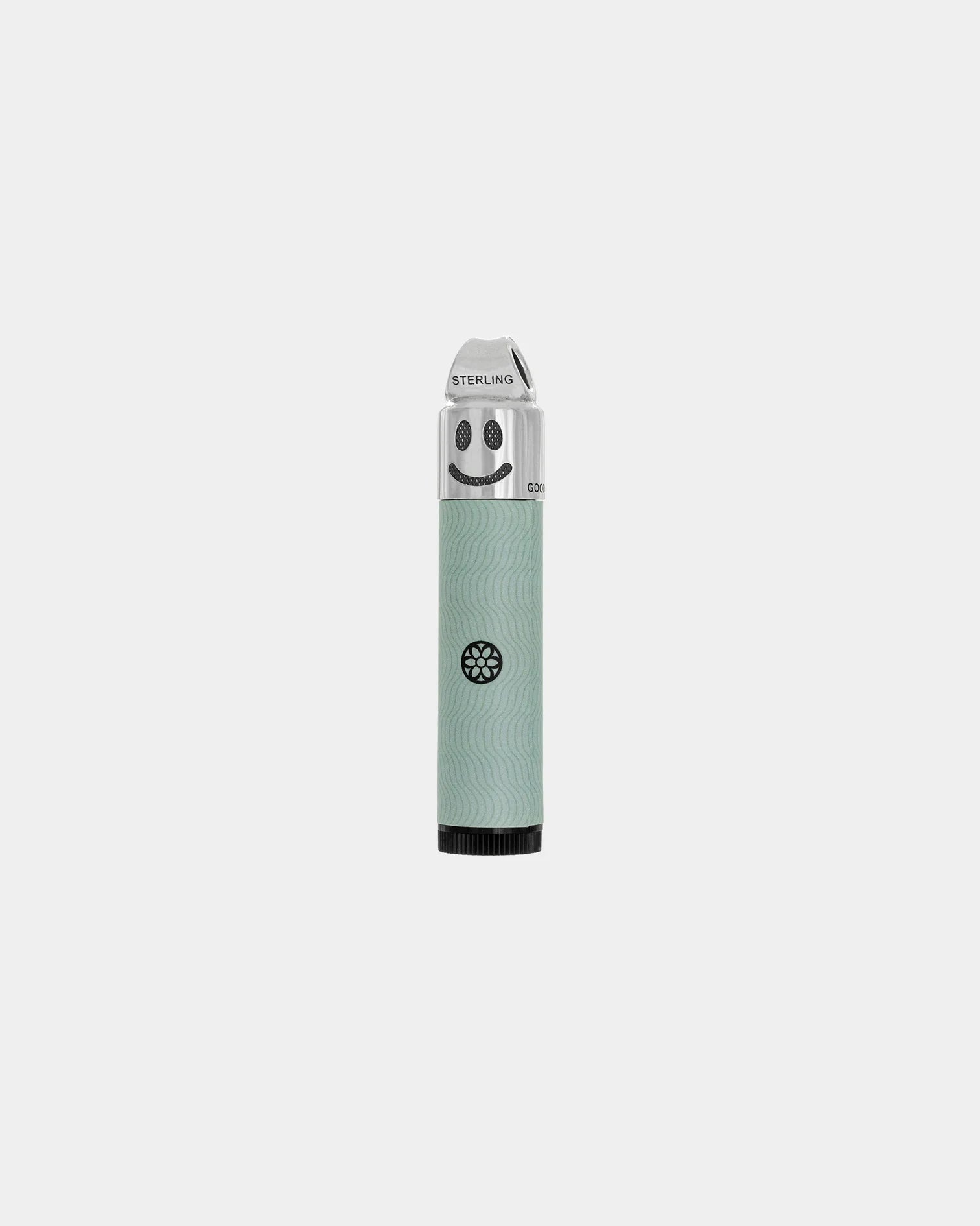 Good Art sterling silver cap balm tube with smiley face design and light green textured body