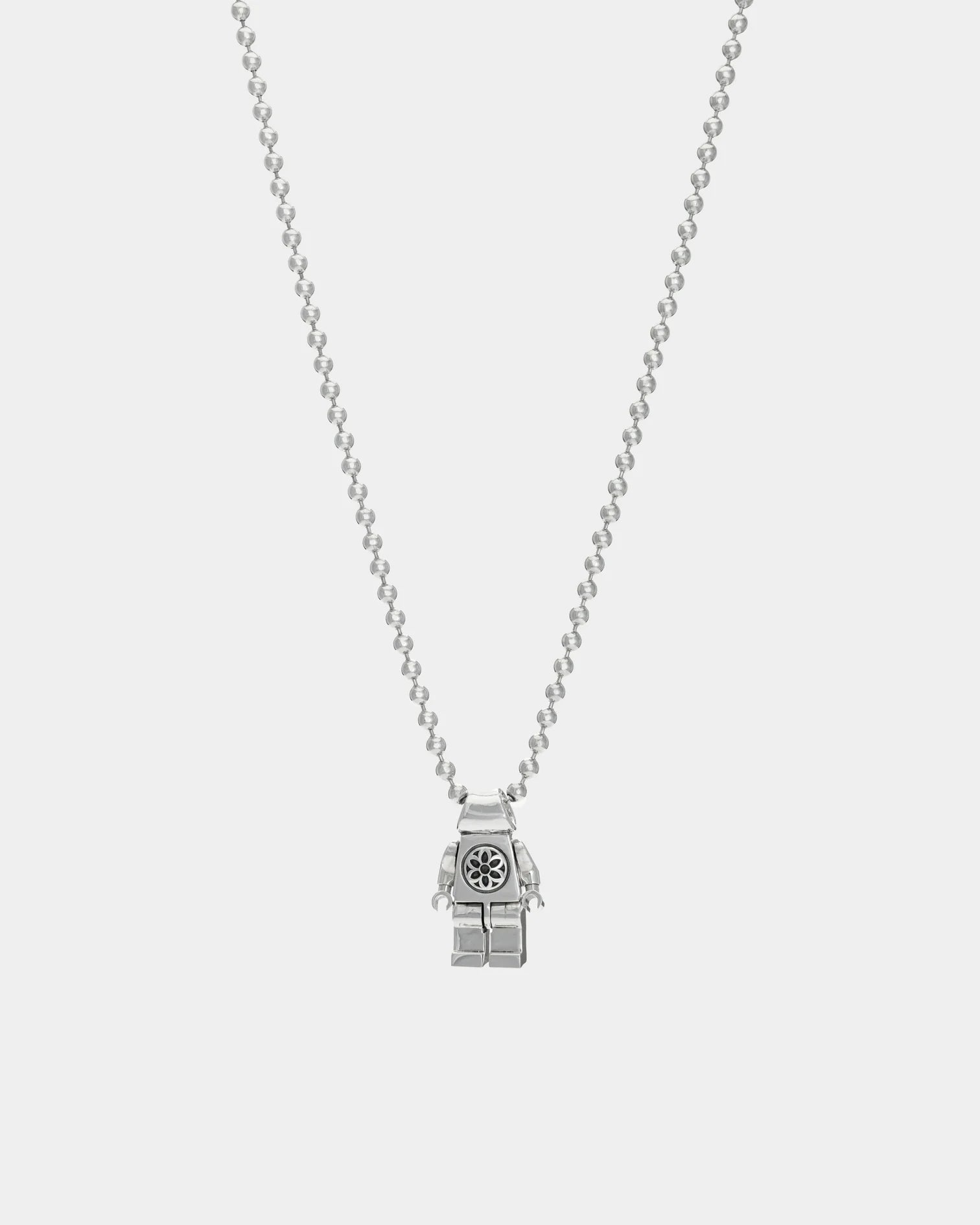 Sterling silver necklace with robot figure pendant and floral detail on chain, Iron Shop Provisions