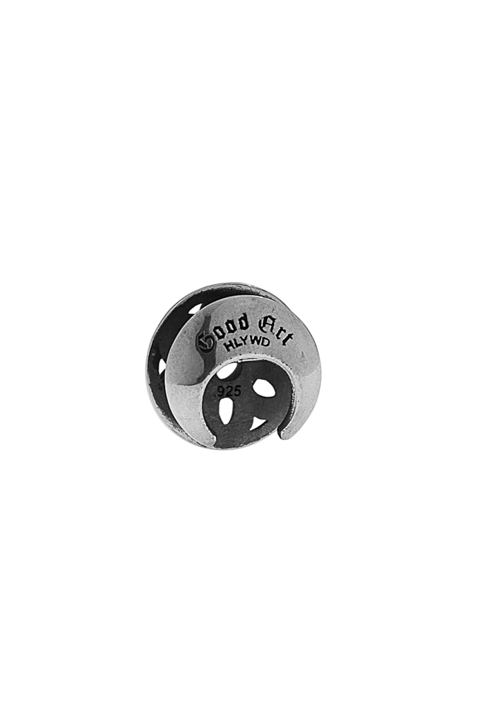 Silver circular Good Art HLYWD 925 metal pin backing against white background