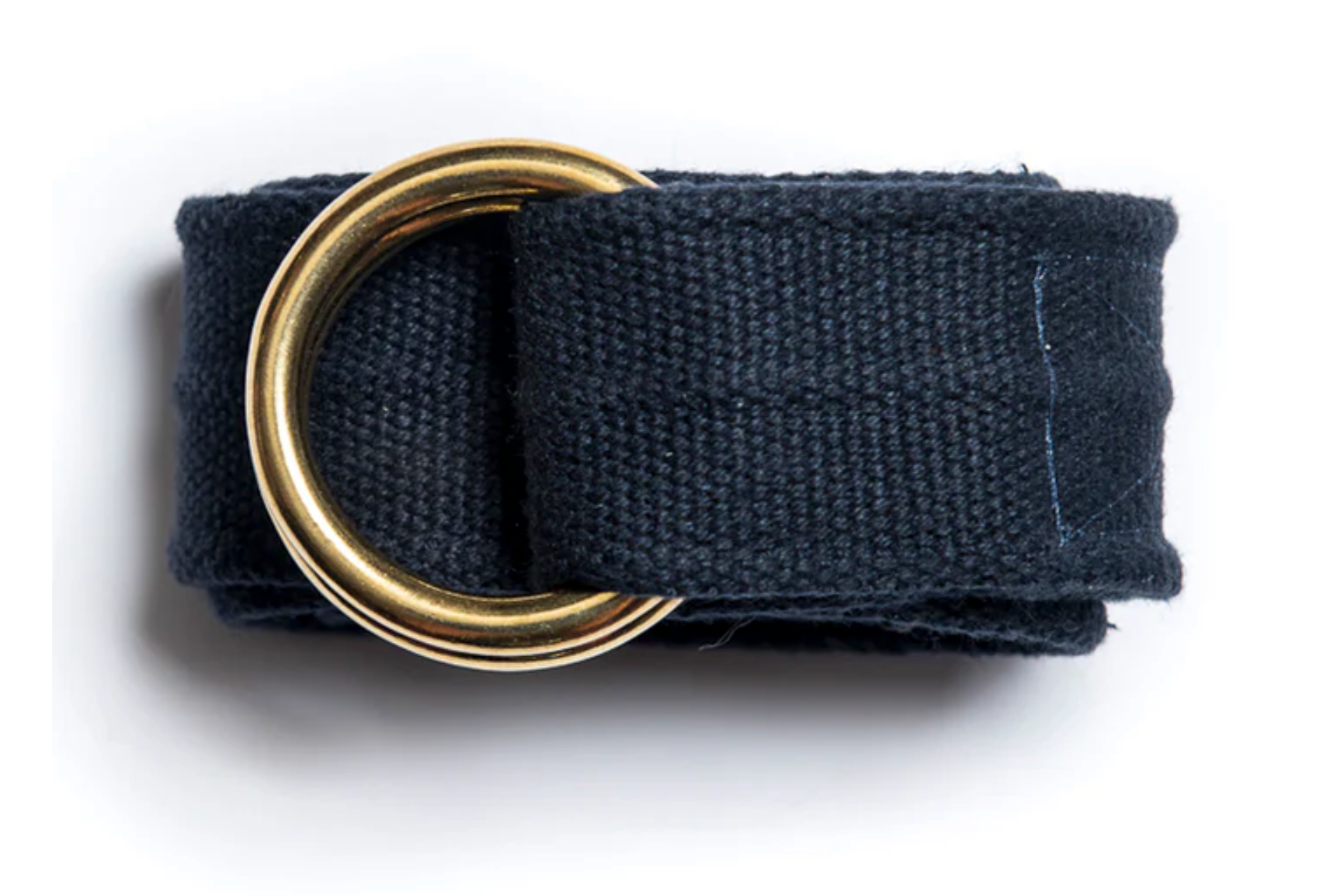 Black belt with a gold ring buckle on a white background