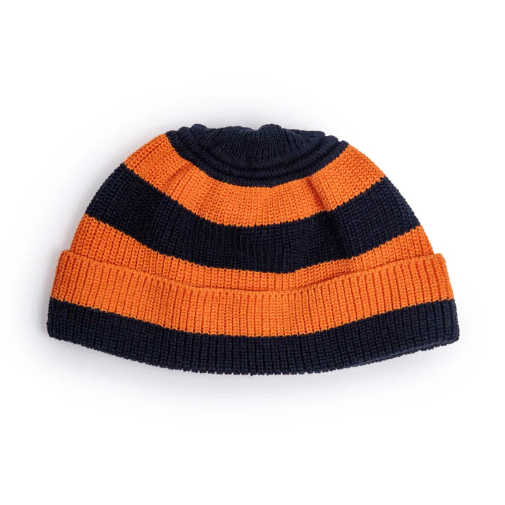 Knitted beanie with orange and navy stripes on a white background