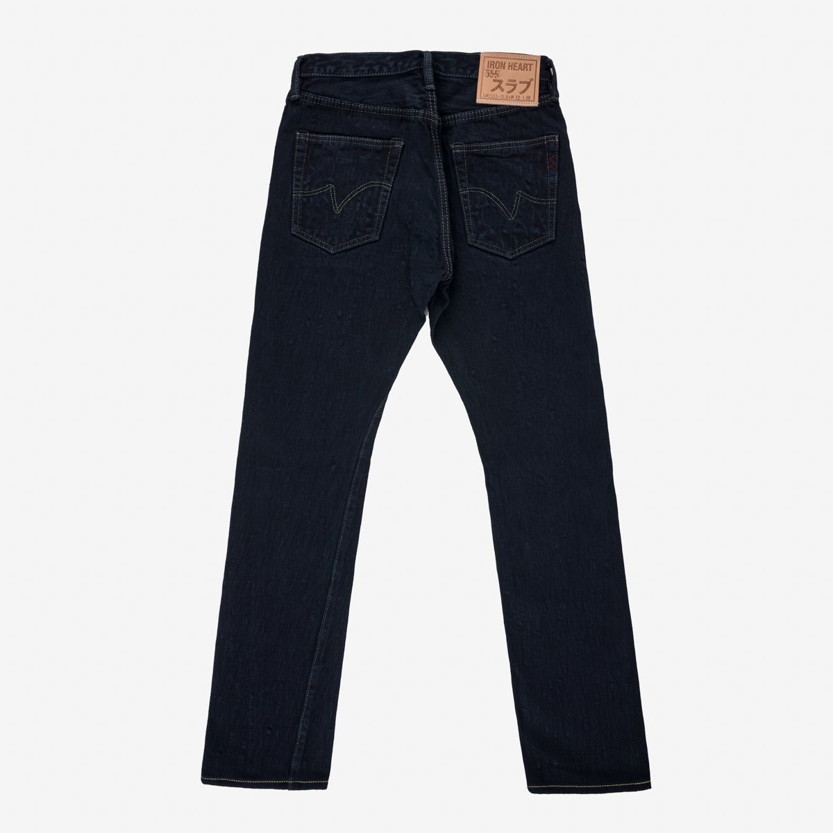 Back view of dark indigo Iron Heart slim straight jeans with contrasting stitching and leather brand patch