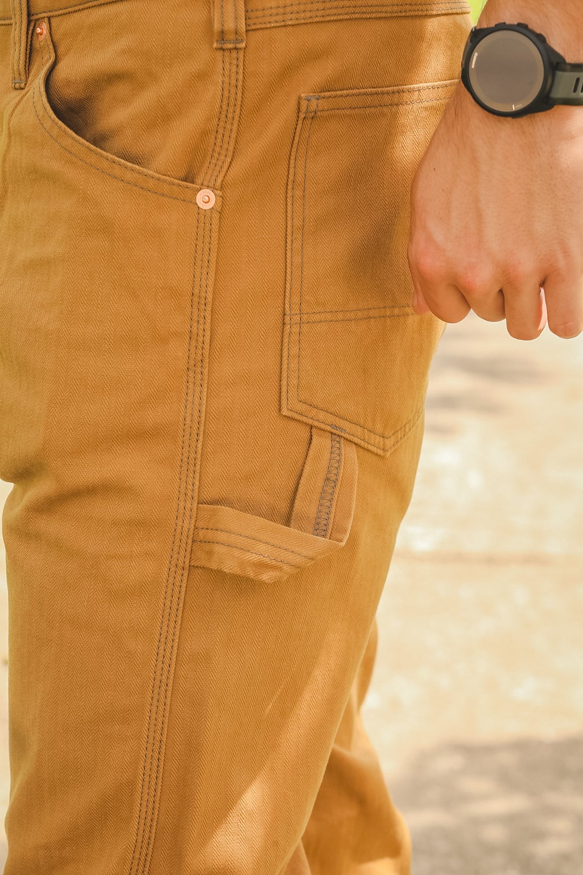 Close-up of brown pants with a blurred background