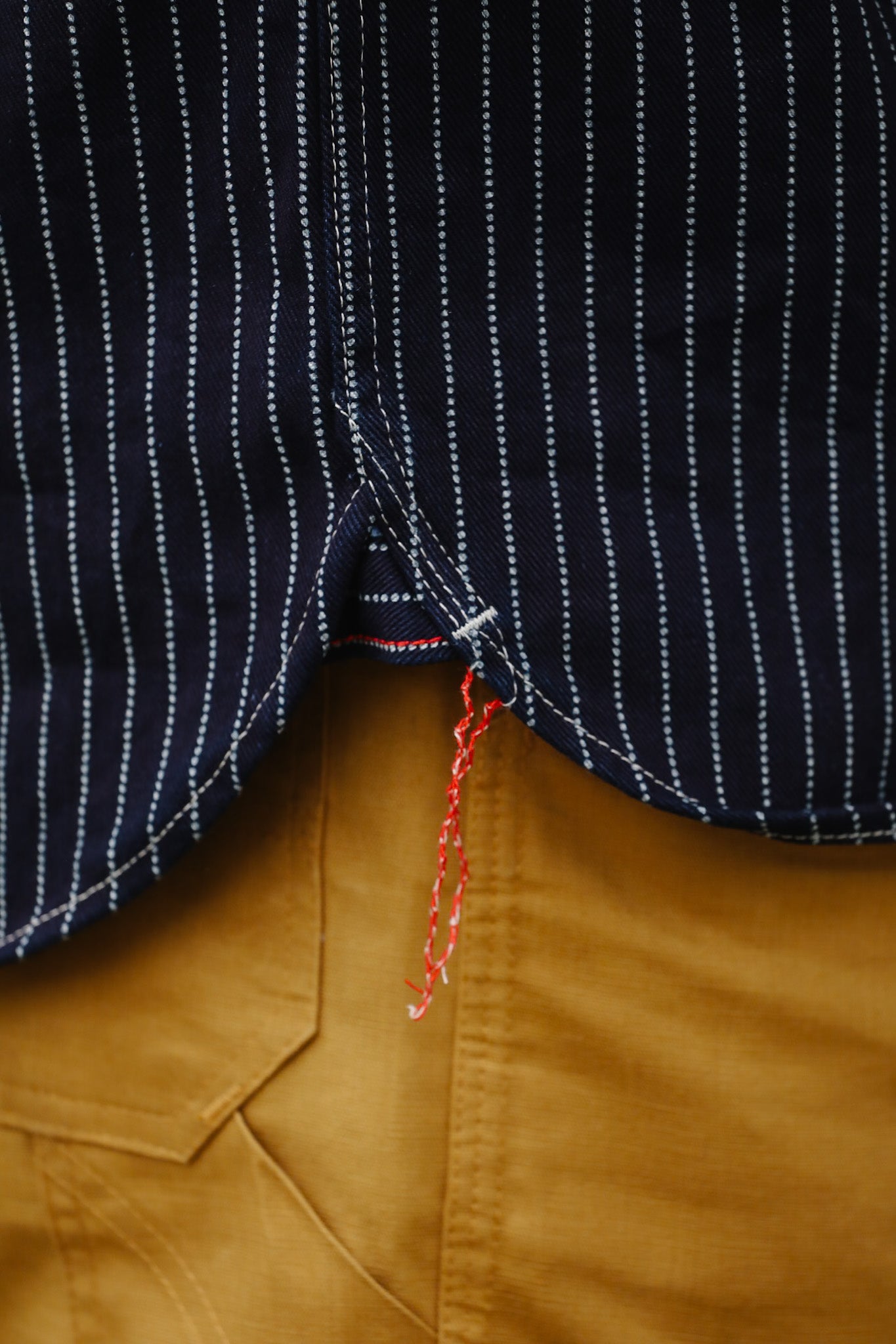 man wearing IHSH-266-IND 12oz Wabash Work Shirt - Indigo With Black Buttons showing side seam