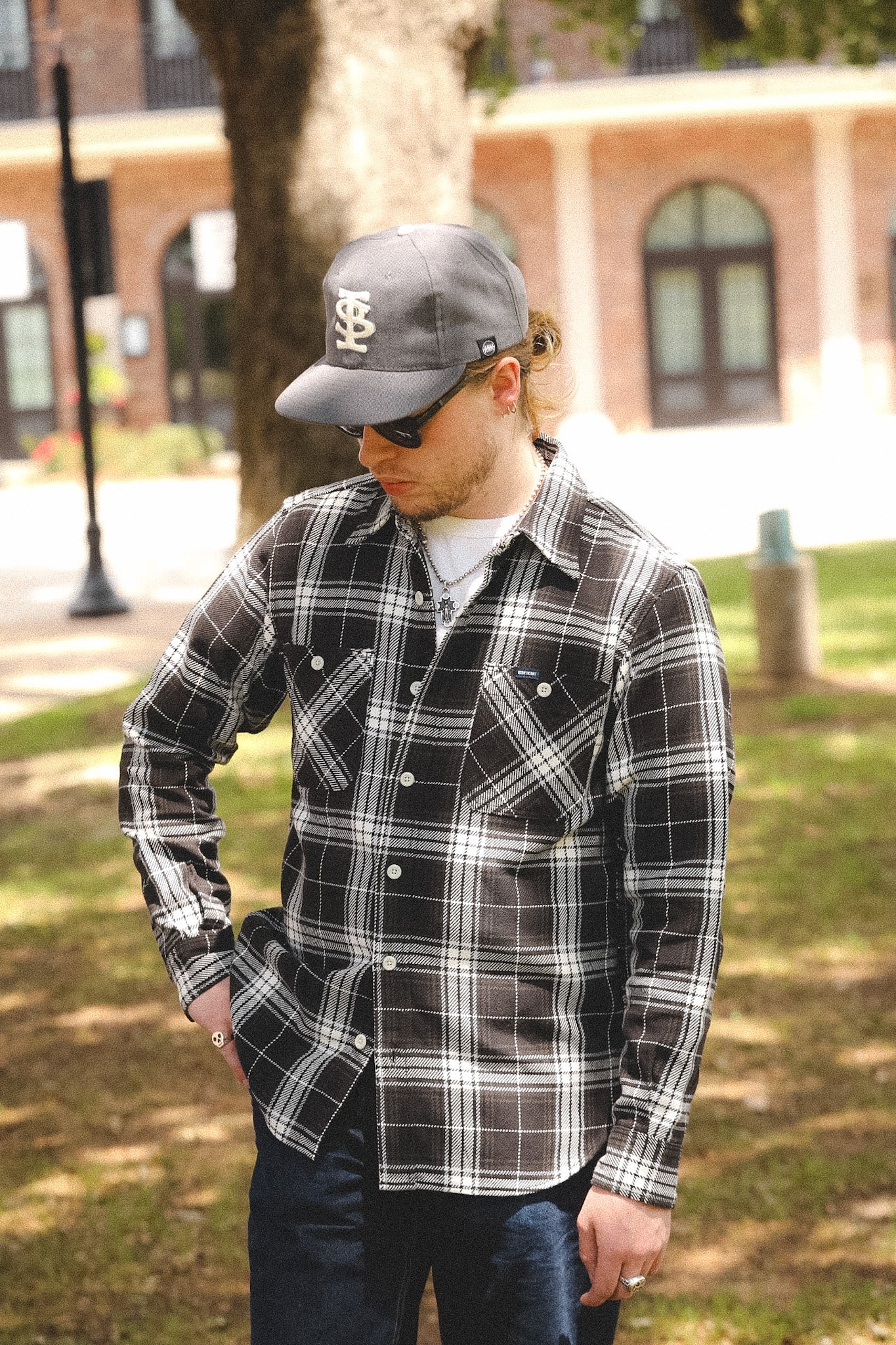 detail of plaid black shirt outdoors on a blurred background 