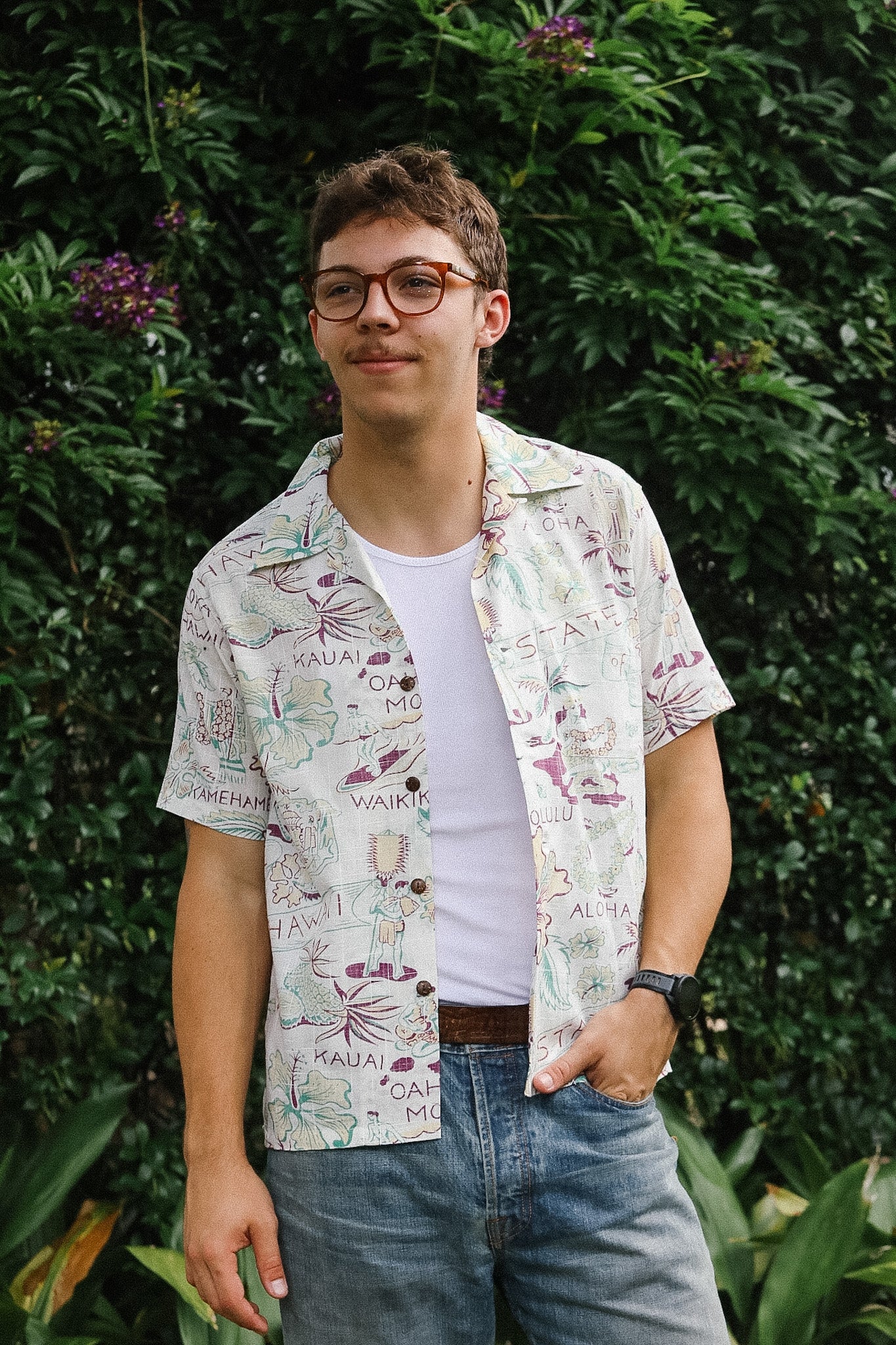 Person wearing a patterned shirt with a white background