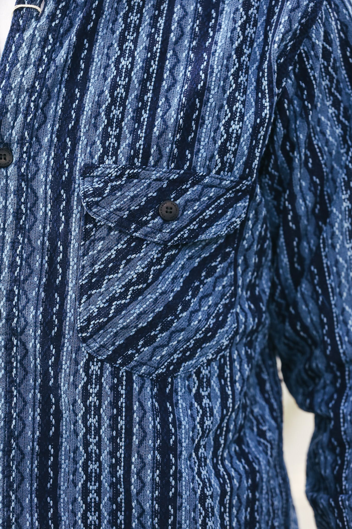 Close-up of a blue patterned shirt with a pocket
