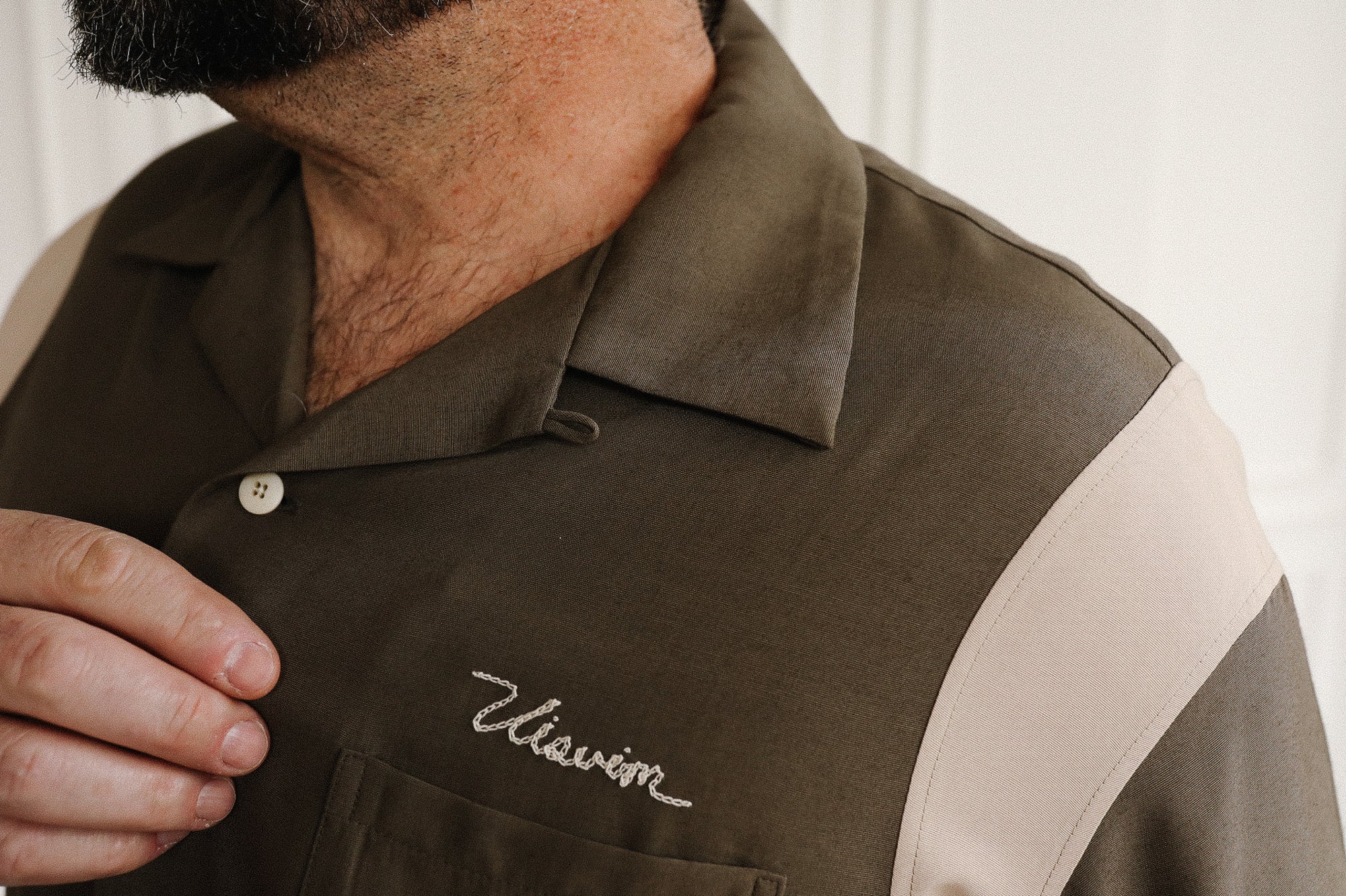 Brown shirt with 'Vivienne' embroidery on a white background