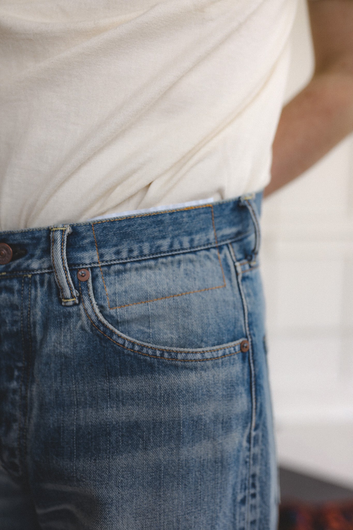 Close-up of blue jeans with a blurred background