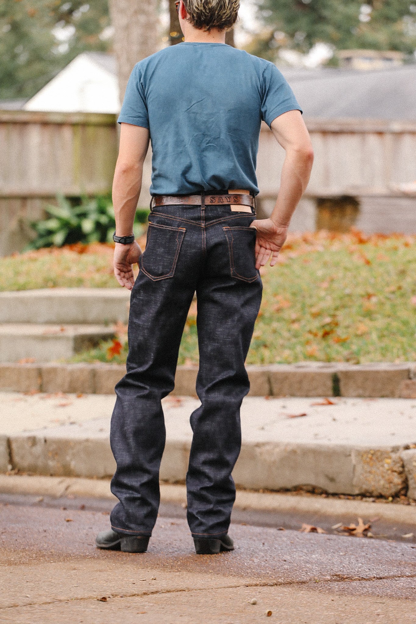 Man wearing dark indigo 20oz double slub wide straight jeans from Iron Shop Provisions, standing outdoors