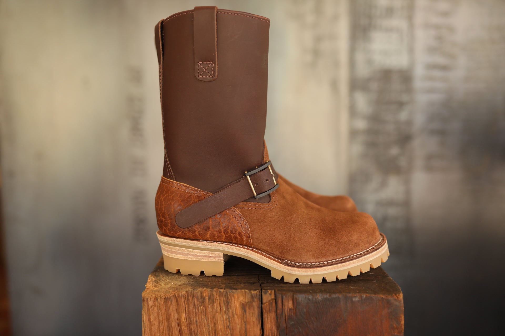 Wesco ISP Boss Engineer Boot in brown leather and suede on wooden block with muted background