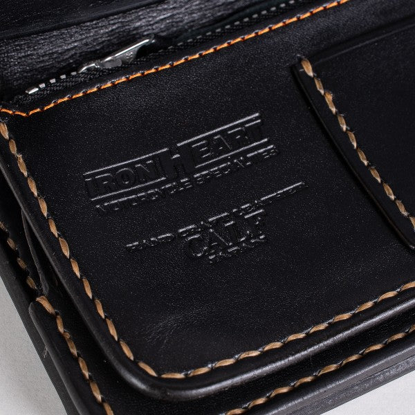 Close-up of black leather wallet with detailed stitching and embossed Iron Heart logo