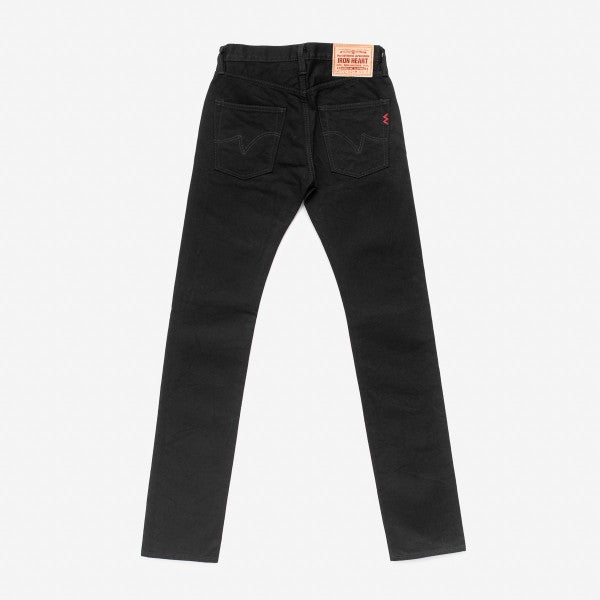 Back view of black slim fit jeans with stitched pockets and Iron Heart leather patch