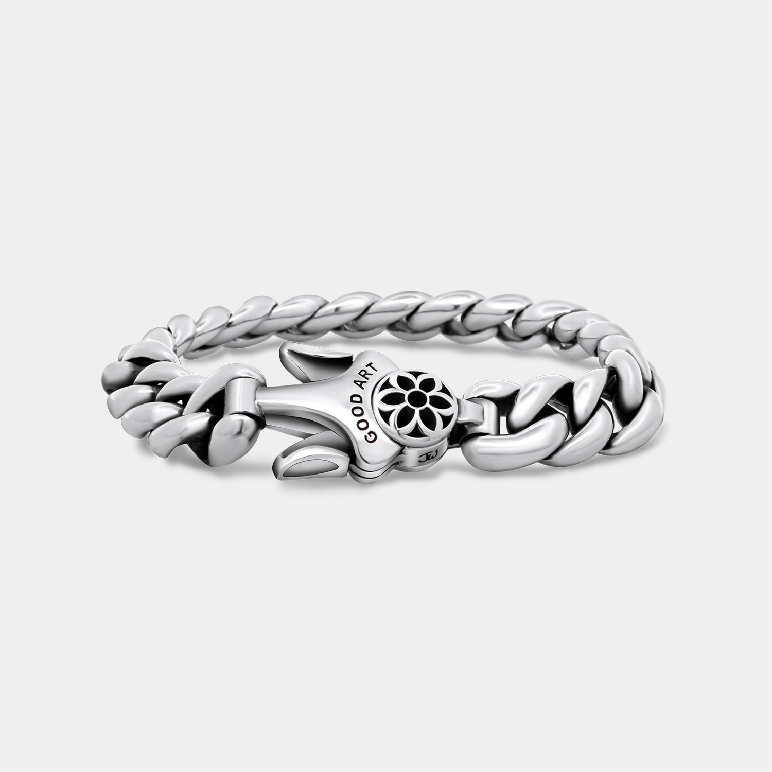 Polished silver chain bracelet with a floral clasp engraved 'GOOD ART' on a white background