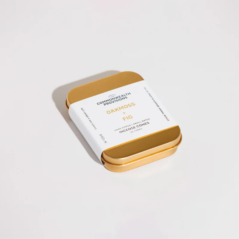 Gold tin of Oakmoss x Fig incense cones by Commonwealth Provisions on white background
