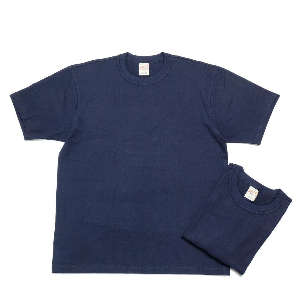 Navy blue t-shirt on a white background, one laid flat and the other folded.