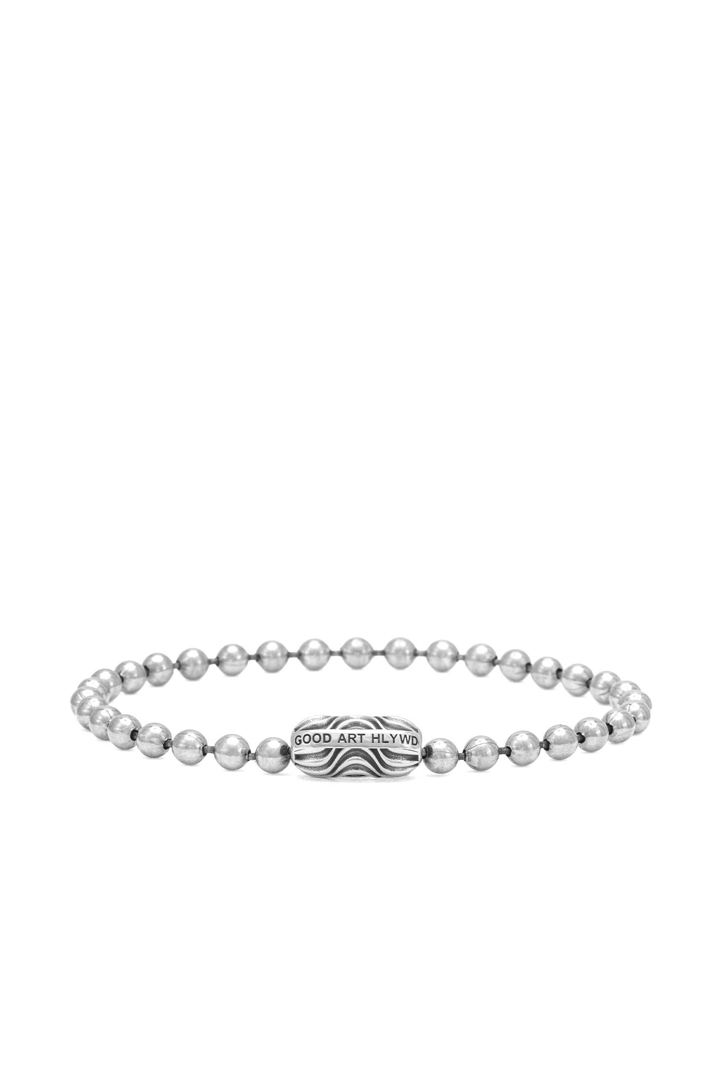 Silver beaded bracelet with central patterned bead engraved GOOD ART HLYWD on white background