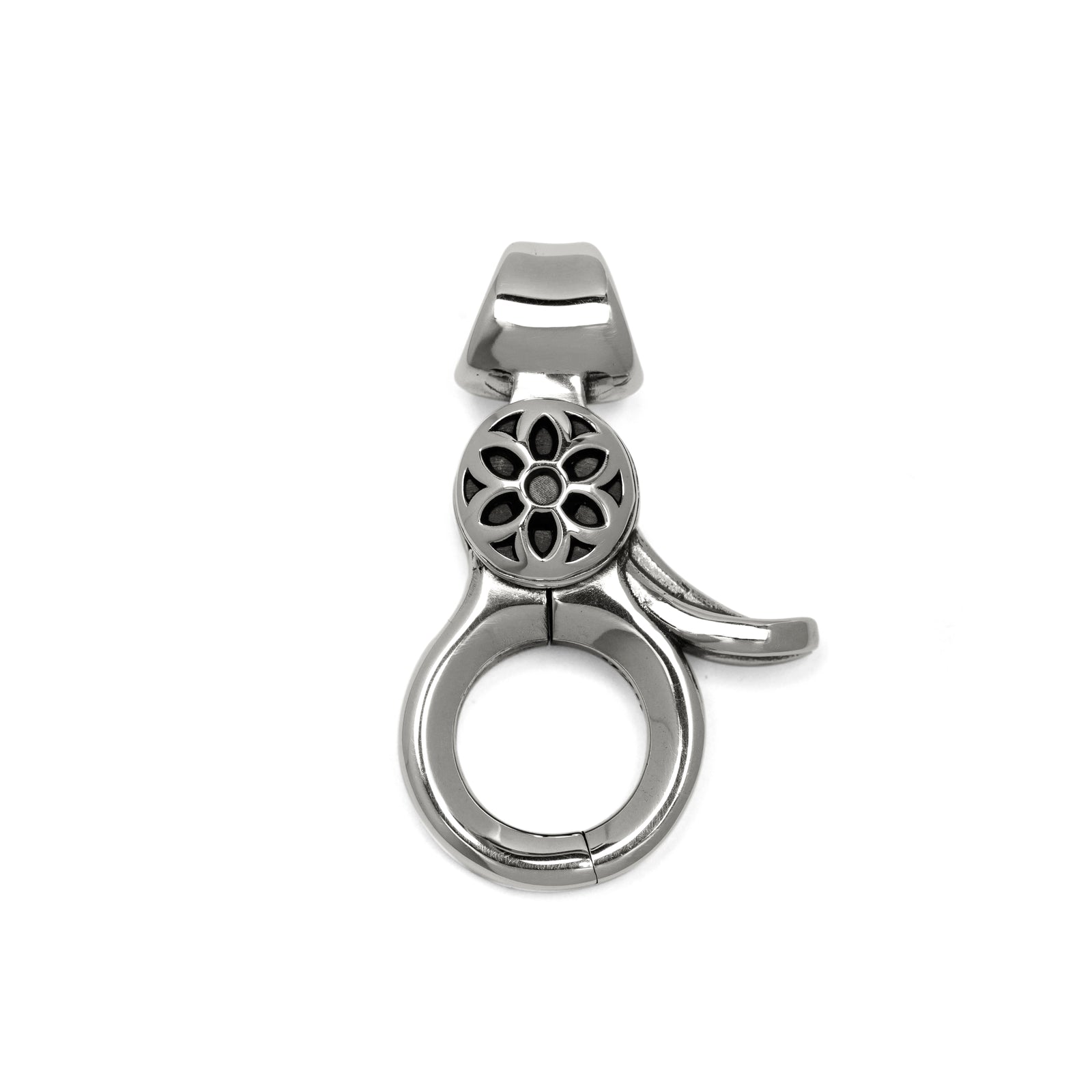 silver metal clip with floral cutout design from Iron Shop Provisions on white background